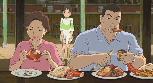 千尋の心配をよそに勝手に料理を食べ始める両親© 2001 Studio Ghibli・NDDTM