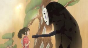 カオナシを千の気を引こうとしているシーン© 2001 Studio Ghibli・NDDTM